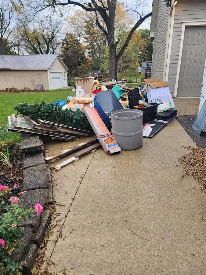 Dumpster being loaded with debris for 30 Yard Dumpster Rental in Tell City